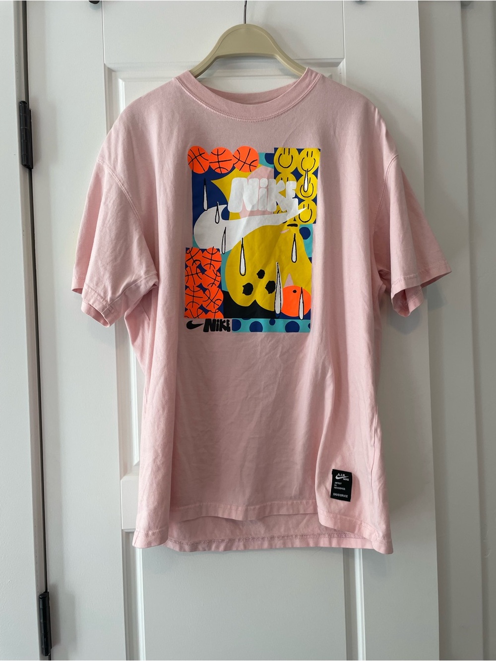 Nike Pink Graphic Short Sleeve Tee with Multicolor Print